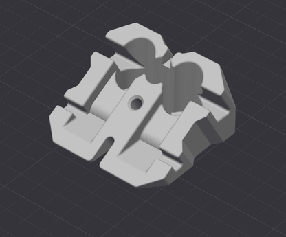 Grey 3D model of a mechanical bracket component with a central hole and interlocking grooves